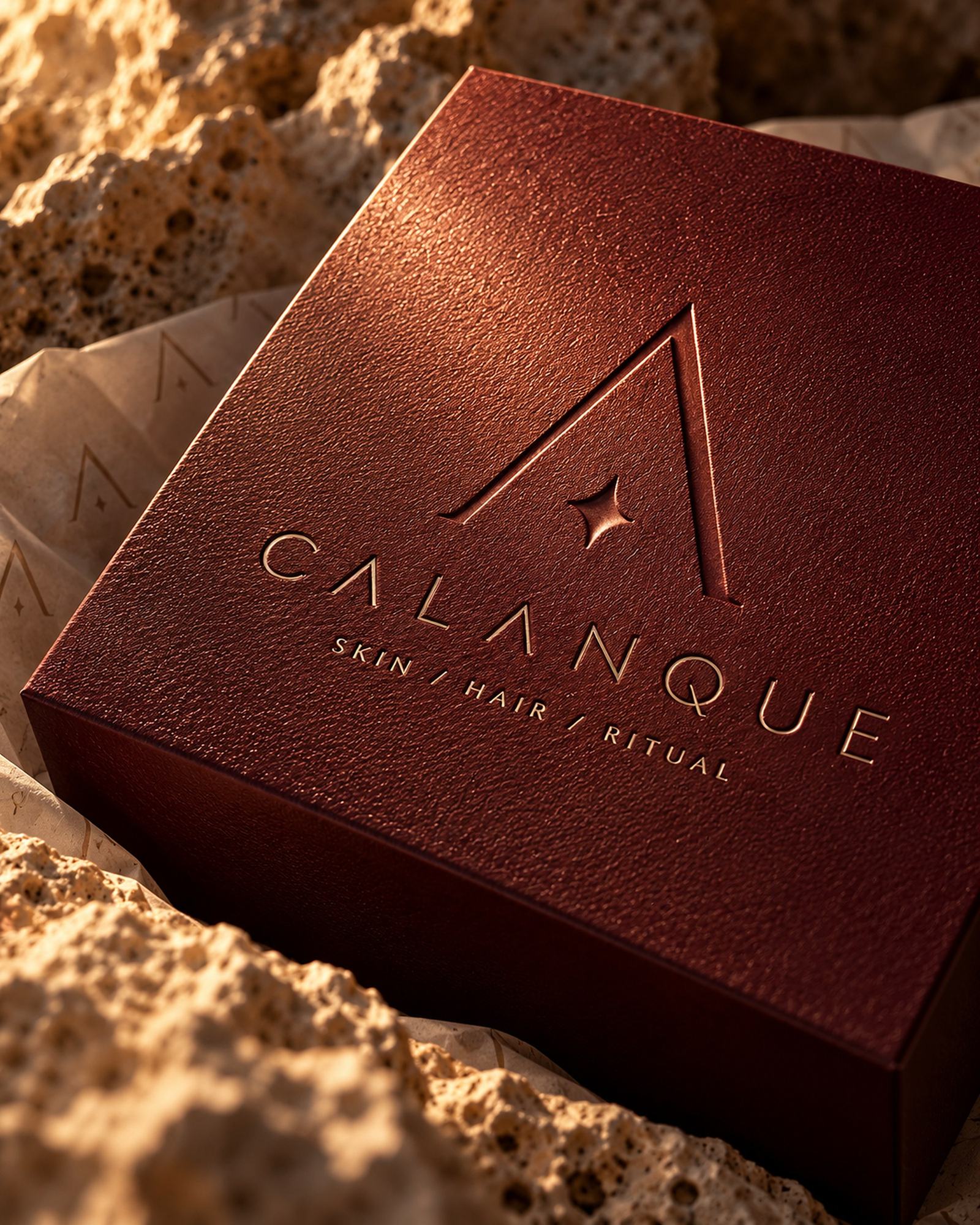The oxblood Calanque box, its mark pressed into the lid